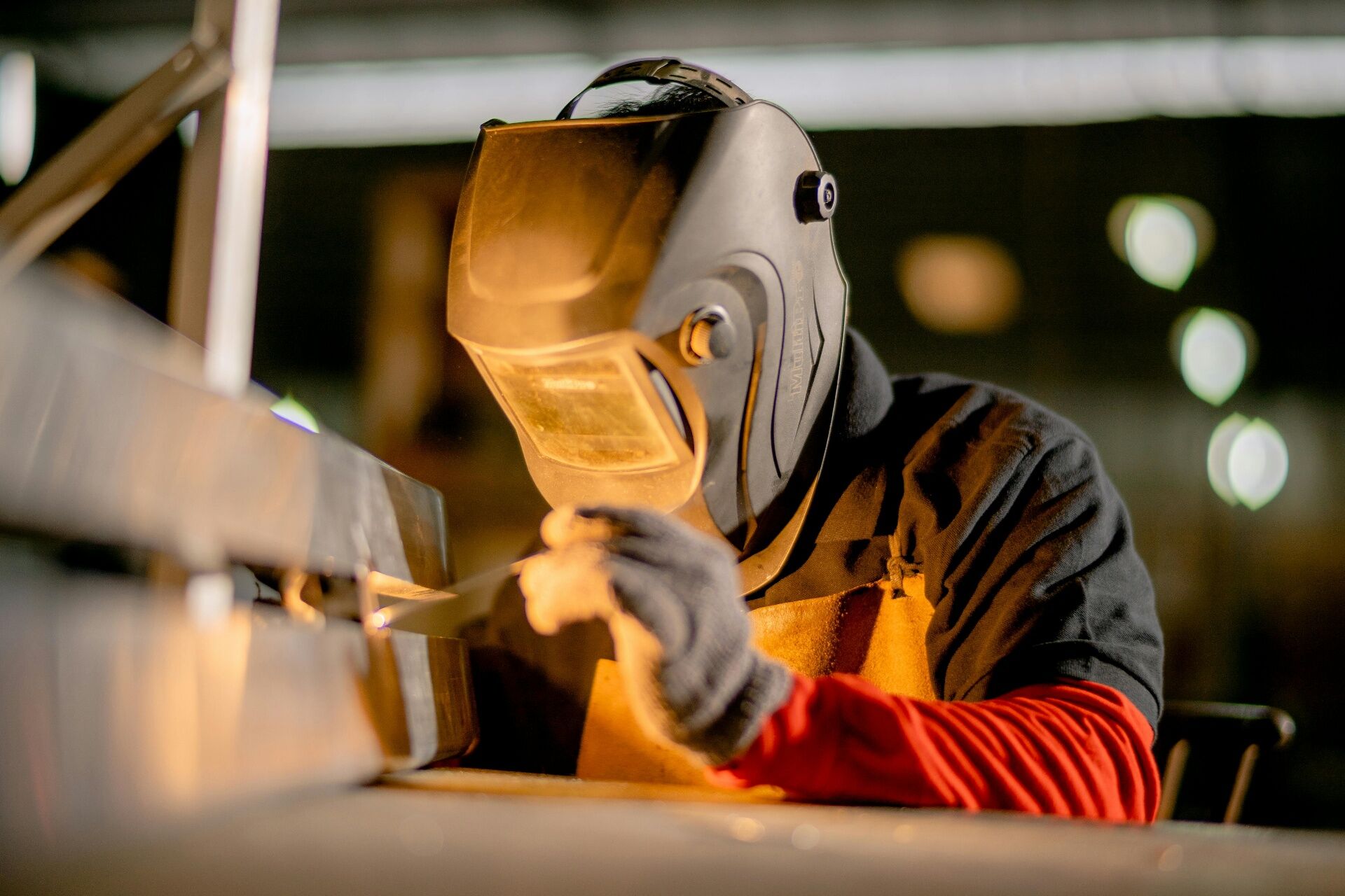 Subcontractor performing precision metalwork on a project site
